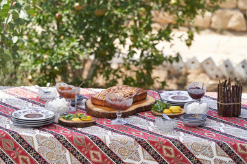 Breakfast table with apple pie, tea glass, outdoors. Homemade Apple Pie