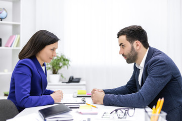 Footage of business partner make a deal in the office.