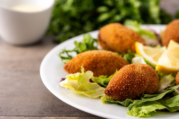 Traditional lebanese kibbeh on wooden table	
