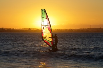 windsurfer on the water at sunset, Rio de Janeiro. Brazil