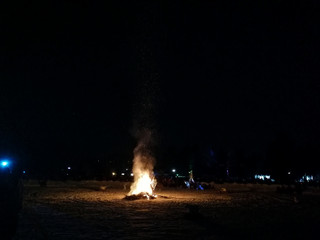 People Gathered around a Bonfire