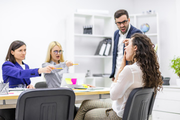 Meeting of young business people in a modern office.