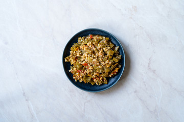 Turkish Olive Oil Food Green Peas / Fasulye Diblesi or Ayse Kadin Dible with Bulgur / Bulghur Rice served in Plate