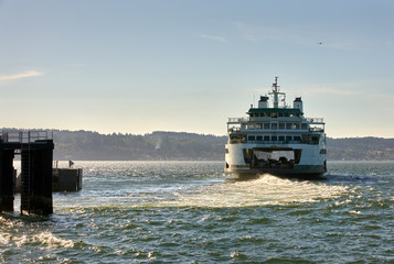 Washington State Ferry Departure. A Washington State ferry leaves the dock on Puget Sound....