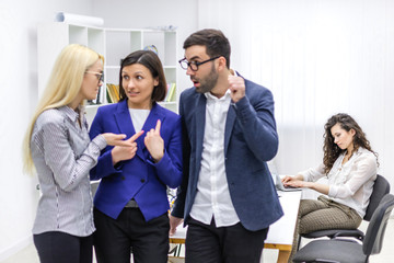 Portrait of three people discussion about business.