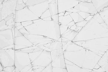 White cracked glass texture background. Texture broken glass window with cracks. Broken screen.