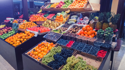 Fototapeta na wymiar Food market showcase with fresh fruits and berries