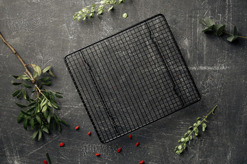Decorated concrete background with grid cake tray