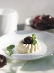 panna cotta cake on a white plate. selected focus