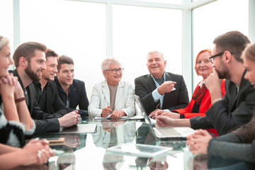 Multiethnic startup business team on meeting in modern bright of