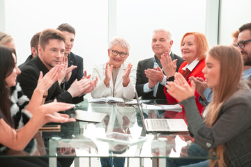 Success group of business people with clapping hands at office.