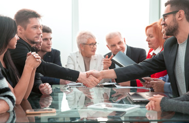 business handshake of businessmen in the office