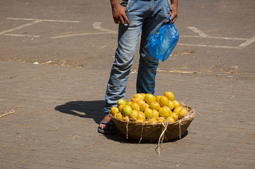 A street seller selling mangoes onside Panjim Market in the South Indian state of Goa.