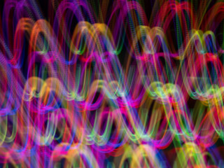 defocused conlorful neon lighting len flare Sound wave pattern background in low shutter speed condition can use for overlay, texture and background in graphic design. technology concept.