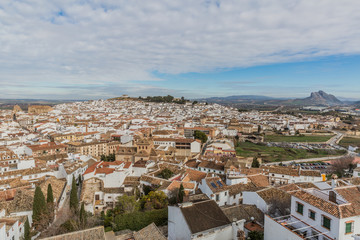Fototapeta premium Panoramic view of the city of Antequera and the Peña de los Enamorados or The Lovers' Rock through, wonderful and cloudy day in the province of Malaga Spain