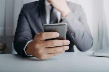 Business people use tablets and hold credit cards as an online shopping concept With a calculator and a book placed on the table with film grain effect