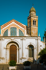 View of fasade and bell tower of Santa Maria in Organo, a Roman Catholic church in Verona, Northern Italy.