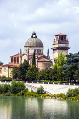 Fototapeta na wymiar Panoramic view of a Roman Catholic church San Giorgio in Braida over the Adige River in Verona, Northern Italy.