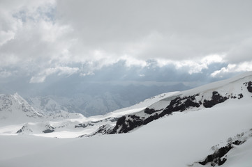 Evening high mountain scenery snow-covered rocky steep mountains of the main mountain range of the...