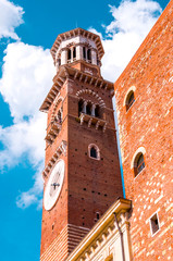 Red brick medieval Lamberti tower in Verona, Italy.