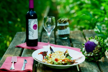Cold beans salad with duck jam served in a ecological vegetable garden