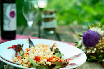 Cold beans salad with duck jam served in a ecological vegetable garden