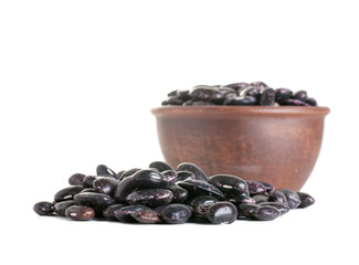black beans, beans in a clay plate, isolated on white background