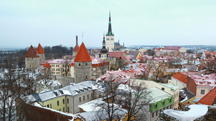 Obraz premium Winter view on roof tiles of Tallinn city buildings