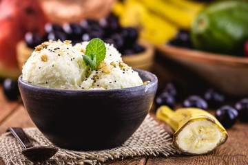 Vegan ice cream made with frozen bananas, with no added dairy, served in a handmade clay bowl.
