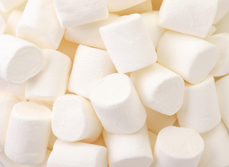 Chewing marshmallow white, background. The view from top
