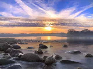 Fotobehang Sunrise by a lake © UniquePhotoArts