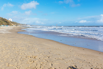 Sandy Bournemount beach in spring, view of the blue sea, selective focus