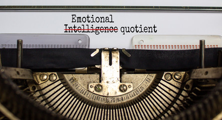 Text 'emotional intelligence quotient' typed on retro typewriter. Concept. Beautiful background.