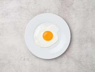 fried egg on gray concrete background