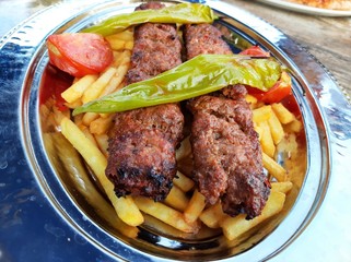 delicious Adana kebab and salads