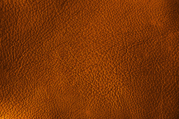 Leather in gold color. Natural leather texture. Background for design