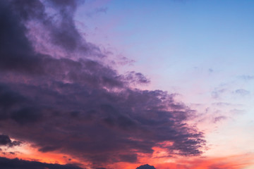 Blue purple sky with gray clouds.