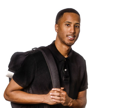 Smiling man studio photo wearing black shirt carrying backpack
