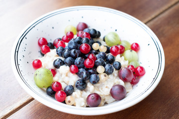 Healthy vegetarian breakfast bowl. Oatmeal porridge with fresh berries mix. Healthy breakfast.