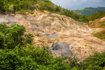 A view across the mud pools in the Sulphur Springs near to Soufriere in St Lucia