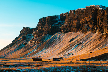 A lonely house at the foot of the mountains in Iceland. Incredible landscapes of nature. Life for a...