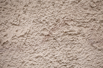 beige textured cement and sand wall