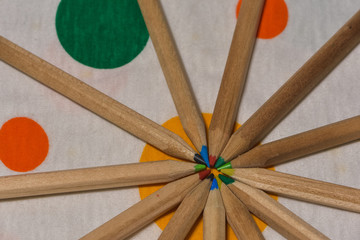 Colored pencils placed like rays. like a sun