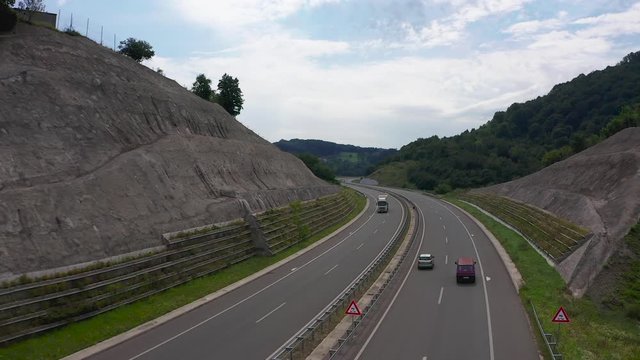 Aerial shot of hipster van driving on a motorway.