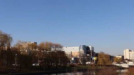 autumn MInsk central street with buildings and quayside