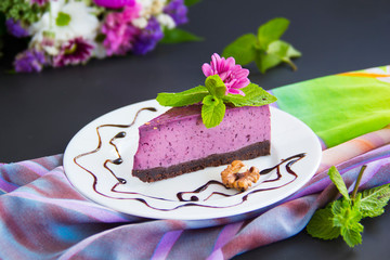 Homemade cheesecake with fresh blueberries and mint for dessert - healthy organic summer dessert pie cheesecake. Creative atmospheric decoration