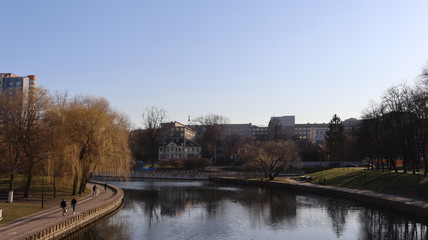 autumn MInsk central street with buildings and quayside
