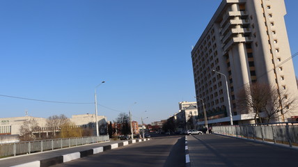 autumn MInsk central street with buildings and quayside