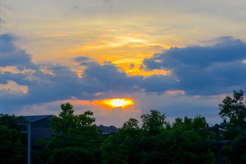 Abstract soft blurred semi silhouette of the sunset with the beautiful sky cloud storm thunderstorm with black silhouette tree foreground