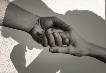Giving helping hand and metal support to someone in need concept. 